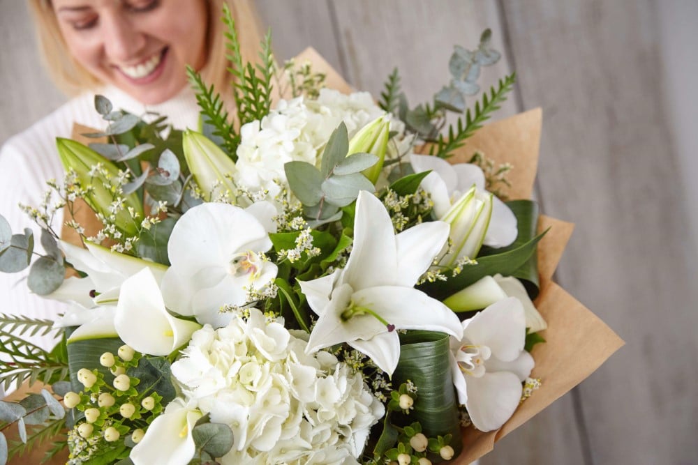 Summer flower bouquet including bright orange and yellow lilies