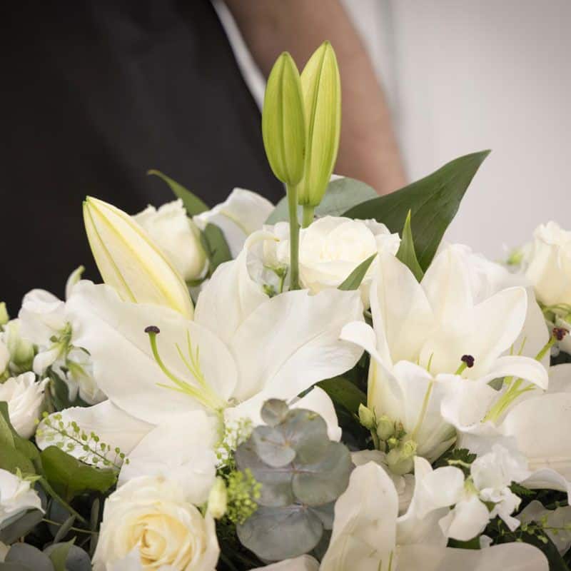 Close-up shot of a birthday bouquet of white lilies